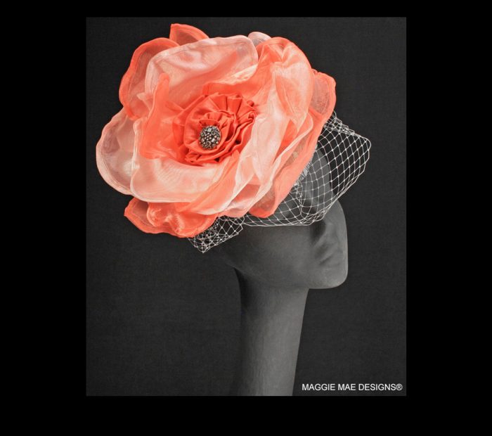 Charlize cocktail hat in coral silk with matching Marguerite