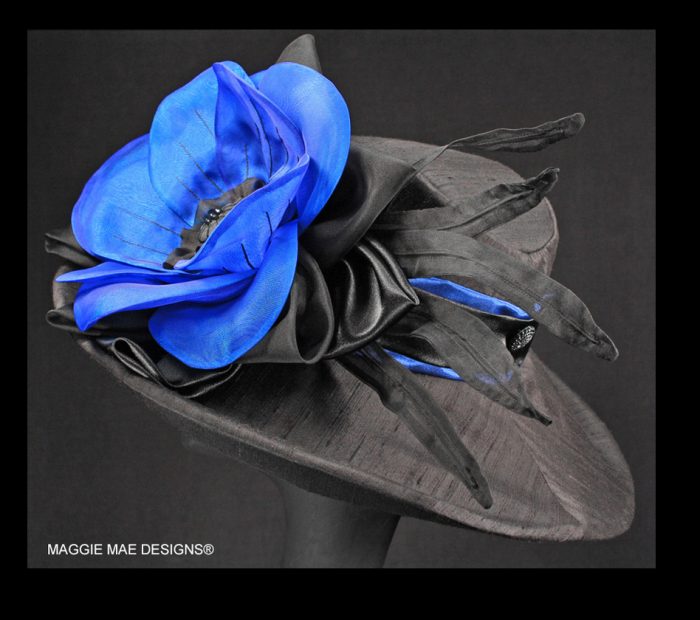 black silk hat trimmed with royal blue Marguerite