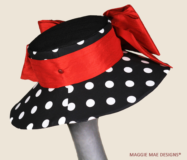 Black and white Chelsea hat trimmed with double red silk bow