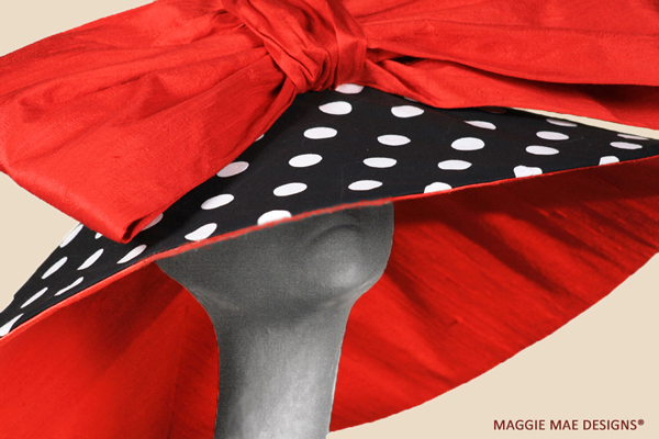 Corinne hat created for Derby in polka dot with red silk bow