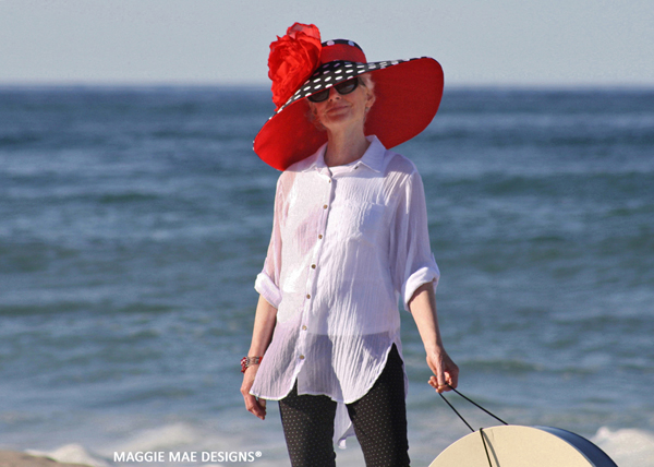 Corinne polka dot Derby hat trimmed with red silk peony