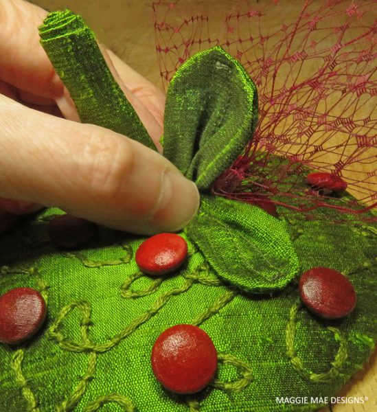 Green silk dupioni cranberry leaves created to adorn the new Berry cranberry fascinator design by MAGGIE MAE DESIGNS