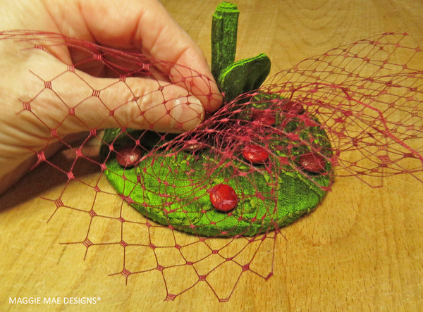 Cranberry hat veiling provides the finishing touch to this new Berry fascinator design that honors Cape Cod cranberries