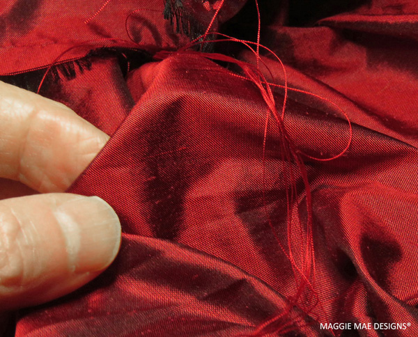 Cranberry silk dupioni that will be the lining for the new Berry fascinator design by MAGGIE MAE DESIGNS