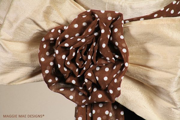 Closeup of the chocolate polka dot chiffon rose curl.